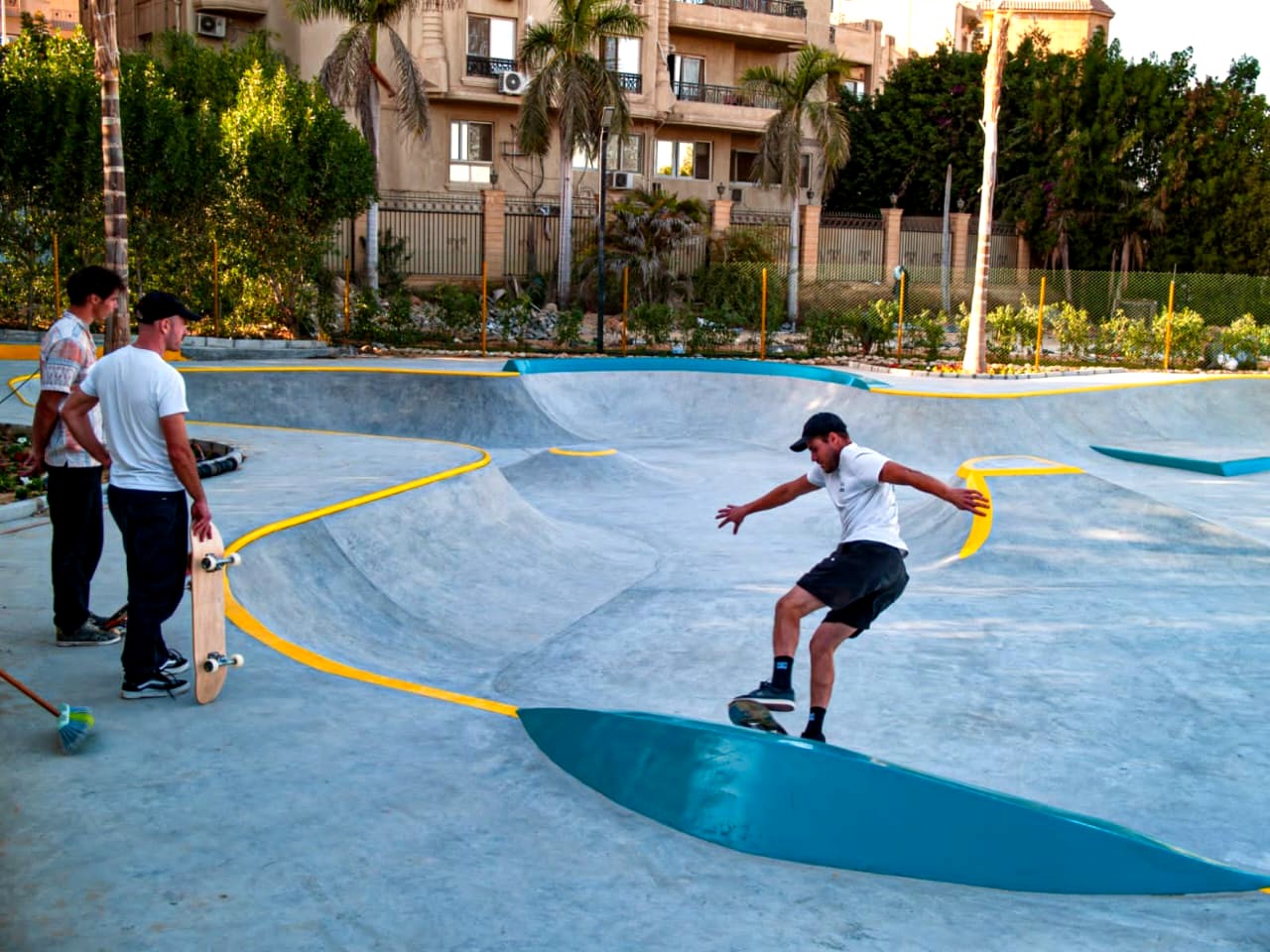 A skateboarder riding the real concrete bowl at Egy Skatepark